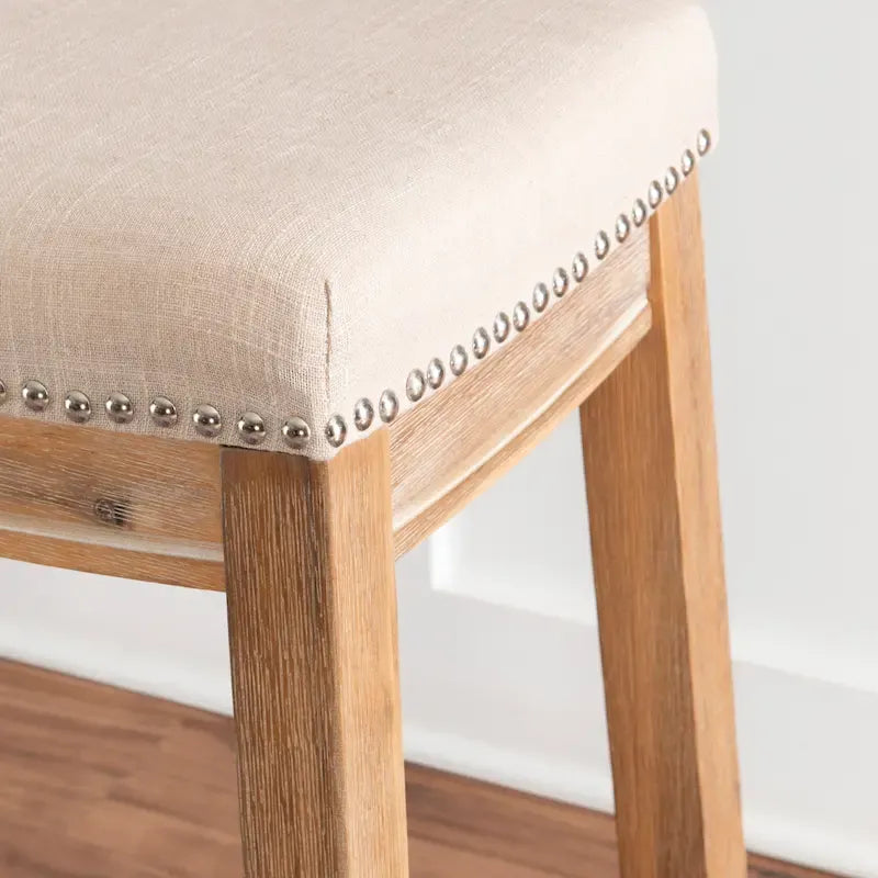 Tabouret de comptoir sans dossier en lin beige/gris avec garniture cloutée, à l'unité